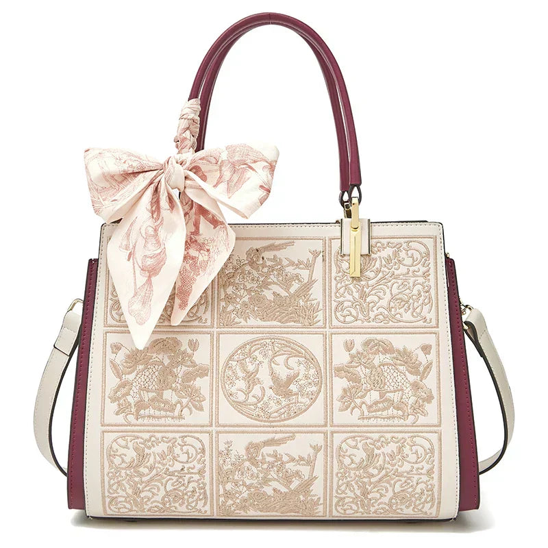 sylvia™ – unik broderi crossbody med sløyfedetalj